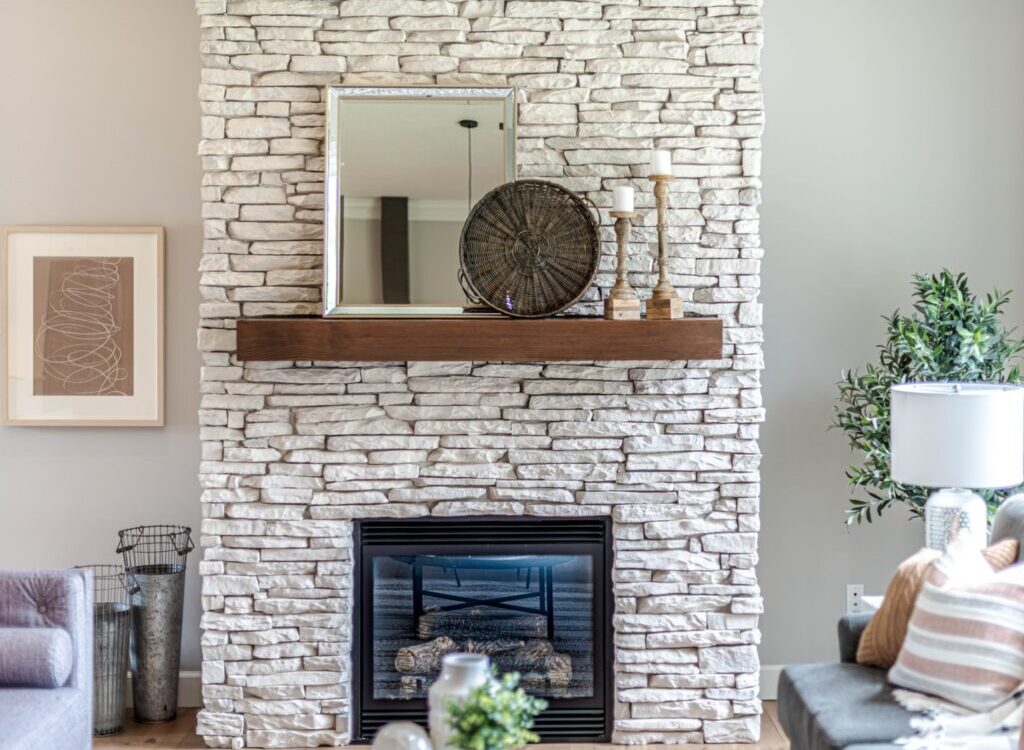 black fireplace in brown brick wall