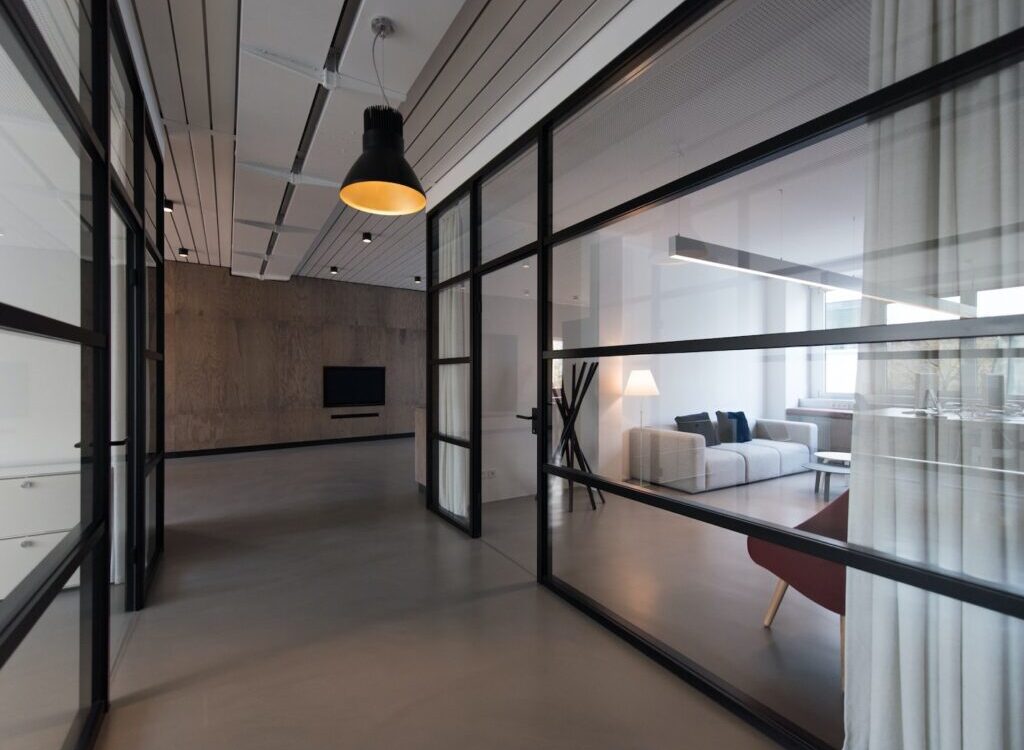 room with glass divider and white curtain