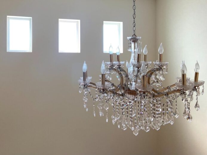 silver and crystal chandelier on white ceiling