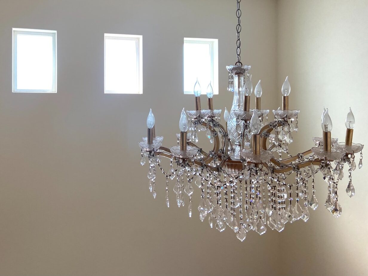 silver and crystal chandelier on white ceiling